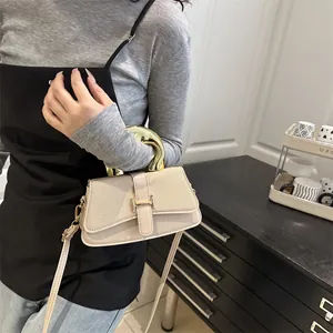 Chic beige crossbody square bag with gold circular handle and metal H buckle detail
