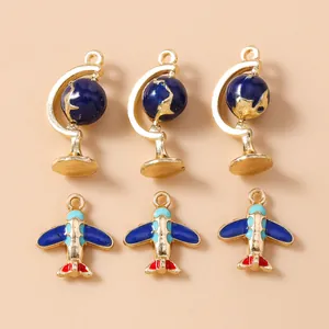 Airplane and globe charm set in blue enamel for DIY jewelry making and keychain crafts