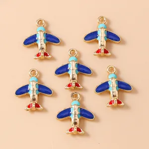 Airplane and globe charms for DIY jewelry making with colorful enamel and gold finish