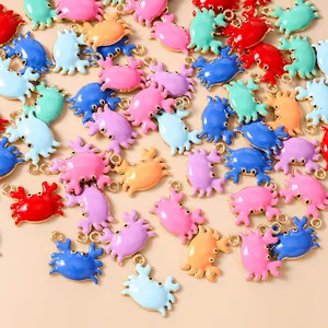 Macro view of colorful enamel crab pendants with gold plating for DIY jewelry making