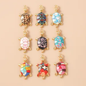 Set of 9 colorful sea turtle charms in gold alloy with diverse enamel patterns for DIY jewelry