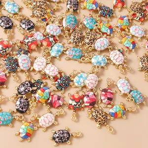 Detailed close-up of mixed colorful turtle charms for DIY jewelry making and crafts