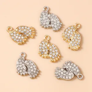 Detailed view of rhinestone paved paw print pendants for DIY jewelry crafting