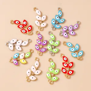 Macro shot of colorful enamel evil eye leaf pendants for DIY jewelry crafting