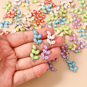 Macro detail of colorful five-leaf evil eye branch pendants with double hanging loops