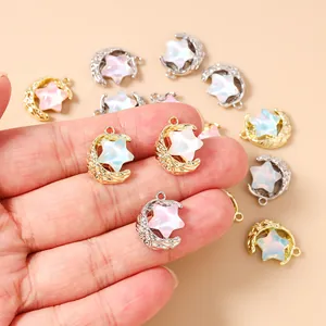 Detail of moon and star charms with iridescent center for DIY jewelry making