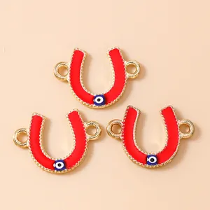Golden horseshoe evil eye connectors in red enamel for jewelry making bracelets
