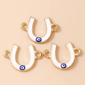Golden horseshoe evil eye connectors for DIY jewelry making necklaces and bracelets