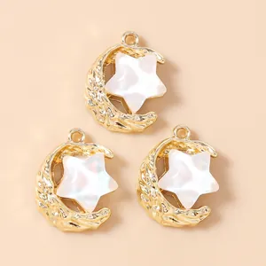 Set of 3 gold alloy star and moon pendants with shell inlay and hammer texture design