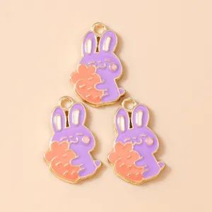 Three purple cartoon rabbit pendants holding carrots with gold plating for DIY jewelry