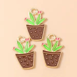 Detail of heart flower cactus pendants with gold alloy frame and drip oil craft