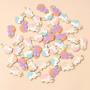 Detail of colorful alloy cartoon rabbit pendants for DIY jewelry and keychain making
