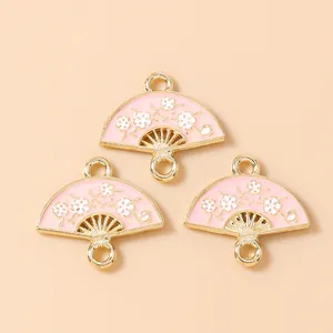 Pink fan-shaped flower charms with gold metal alloy and white plum blossom patterns