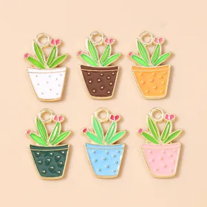Flat lay of colorful alloy enamel cactus potted plant charms for DIY jewelry making
