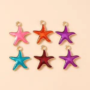 Detailed macro view of colorful enamel starfish pendants with golden metal frames for DIY jewelry