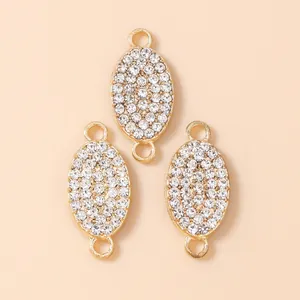 Three gold-plated oval rhinestone connector charms for DIY necklaces and bracelets