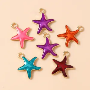 Detail view of colorful enamel starfish pendants with gold plated edges for DIY jewelry