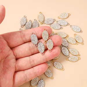 Detailed macro view of gold and silver oval pave connectors for DIY jewelry making