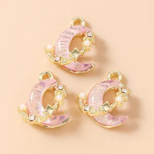 Set di 5 ciondoli a luna e stella placcati oro con resina rosa e strass per gioielli