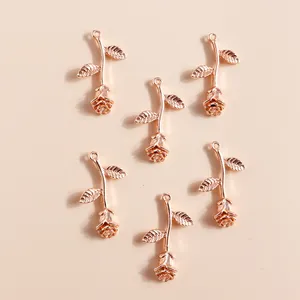 Rose gold flower pendants set with intricate leaf details and rings for jewelry making