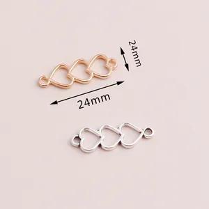 Detalle de conectores de triple corazón de 24mm para joyería DIY en oro y plata