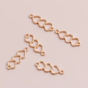 Pack de 50 colgantes de triple corazón dorado para accesorios de joyería DIY