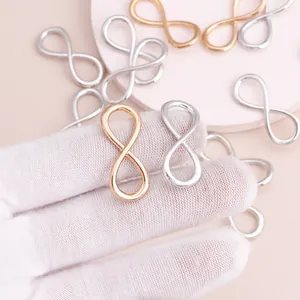 Colgantes de símbolo infinito en oro y plata para la creación de joyas artesanales