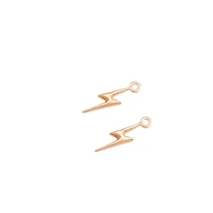 Two rose gold lightning bolt charms for DIY jewelry making with polished metallic finish