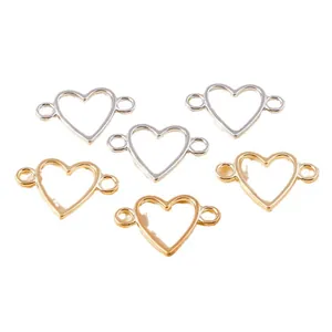 Connettori a cuore cavo oro e argento con doppi occhielli per creazione gioielli