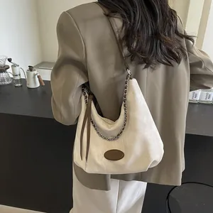 Contrast color large tote bag with brown leather strap and silver chain detail