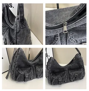 Vue détaillée du sac en jean montrant la texture délavée et les boucles métalliques