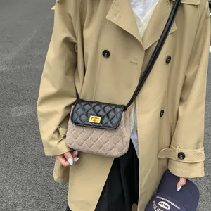 Quilted contrast crossbody bag in black leather and beige suede with gold clasp