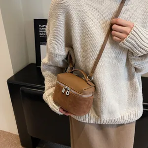 Chic brown matte suede and pebbled leather crossbody box bag with dual metal zippers