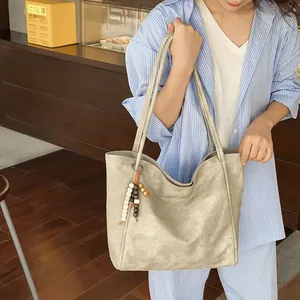 Minimalist grey-green tote bag in matte finish with vintage beaded charm and large capacity