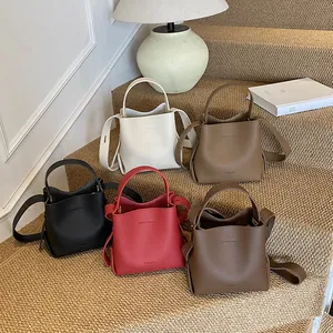 Litchi pattern bucket handbag in five colors with top handle and crossbody strap