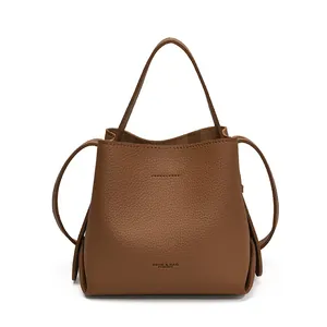 Minimalist brown lychee pattern bucket handbag with top handle and shoulder strap