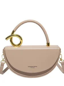Fashionable nude beige semi-circular saddle bag with golden hardware and top handle