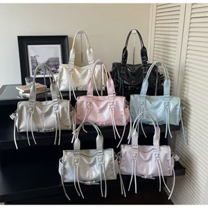 Glossy PU leather tote bags in various colors with tassels and metal eyelet details
