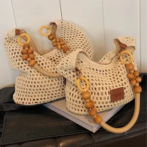 Handcrafted crochet beach bag with wooden bead handle and spacious hollow knit design