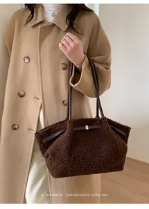Detail of a brown plush tote bag with leather straps and minimalist retro design