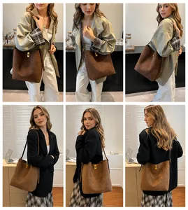 Detailed view of suede bucket bags in brown and tan with elegant golden metal twist locks