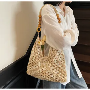 Detail of hand-woven crochet bag with wooden bead straps and tulip interior decoration