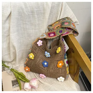 Close-up of handmade crochet tote bag with colorful 3D woven floral patterns