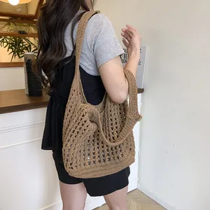 Brown crochet hollow tote bag with mesh design and long shoulder strap in summer style