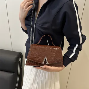 Dark brown crocodile embossed handbag with silver A-shaped hardware and metal chain strap