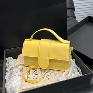 Minimalist bright yellow leather shoulder bag for women with fashion slogan and top handle