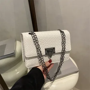 White woven leather chain shoulder bag with V-shaped metal lock and rivet details