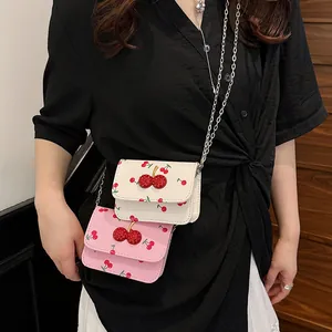 Chic mini chain crossbody bag with cherry prints and rhinestone cherry charm details