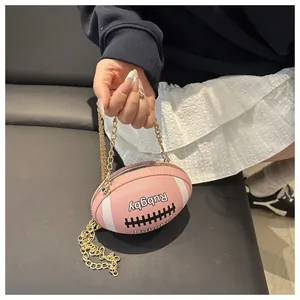 Close-up of pink rugby-shaped bag featuring white stripes and a golden metal chain strap