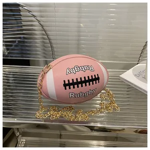 Detail of pink rugby-shaped bag featuring white stripes, top zipper and gold chain strap
